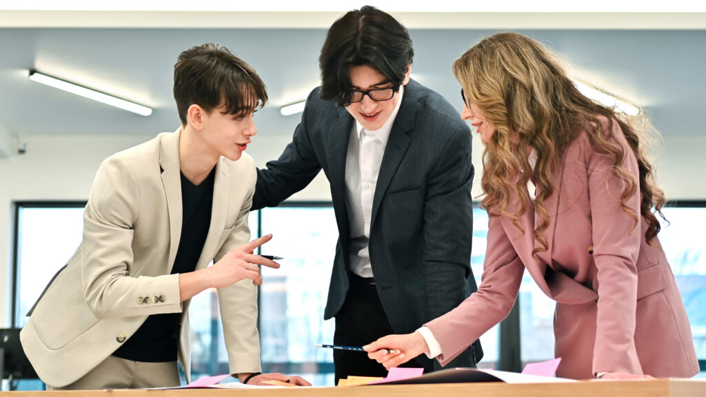 Sales and marketing students in a huddle